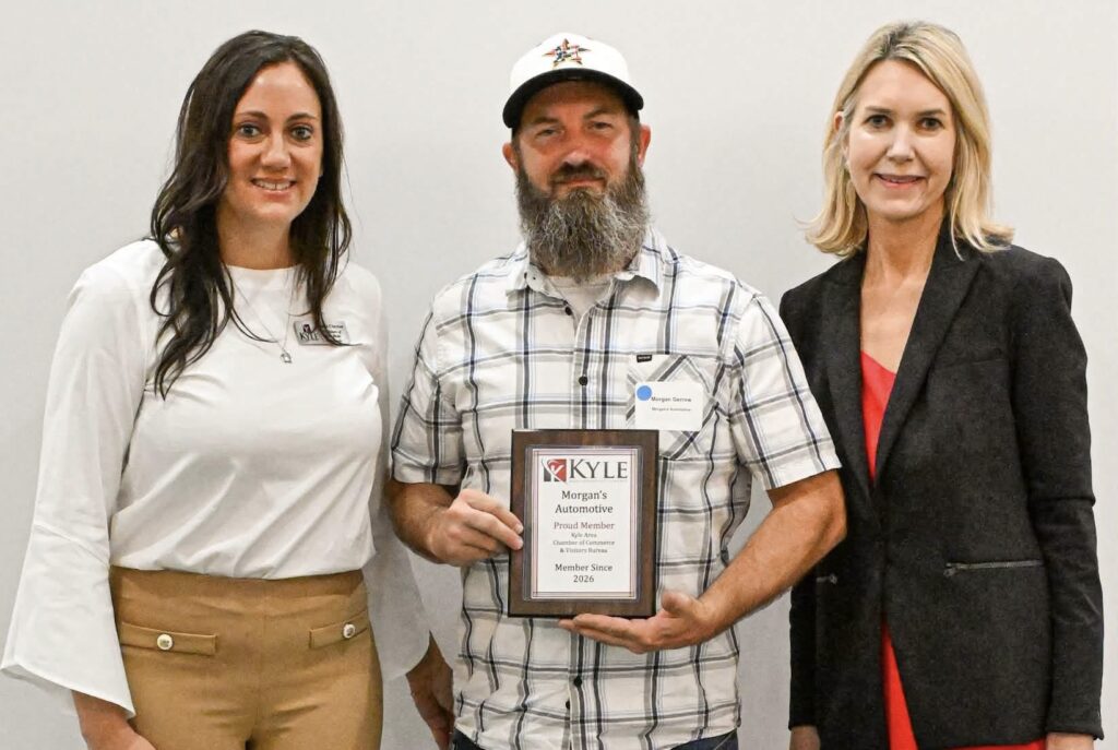 Morgan's Automotive owner proudly receives his Kyle Area Chamber of Commerce membership plaque at the 2026 induction ceremony in Kyle, Texas.